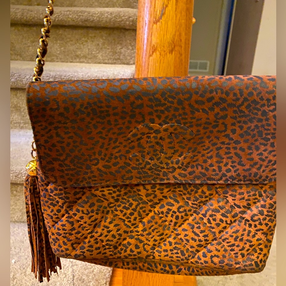 Vintage Chanel animal print clutch with shoulder strap